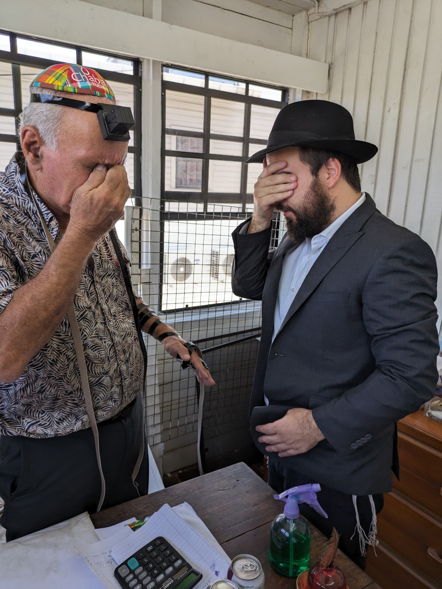 Putting on tefillin