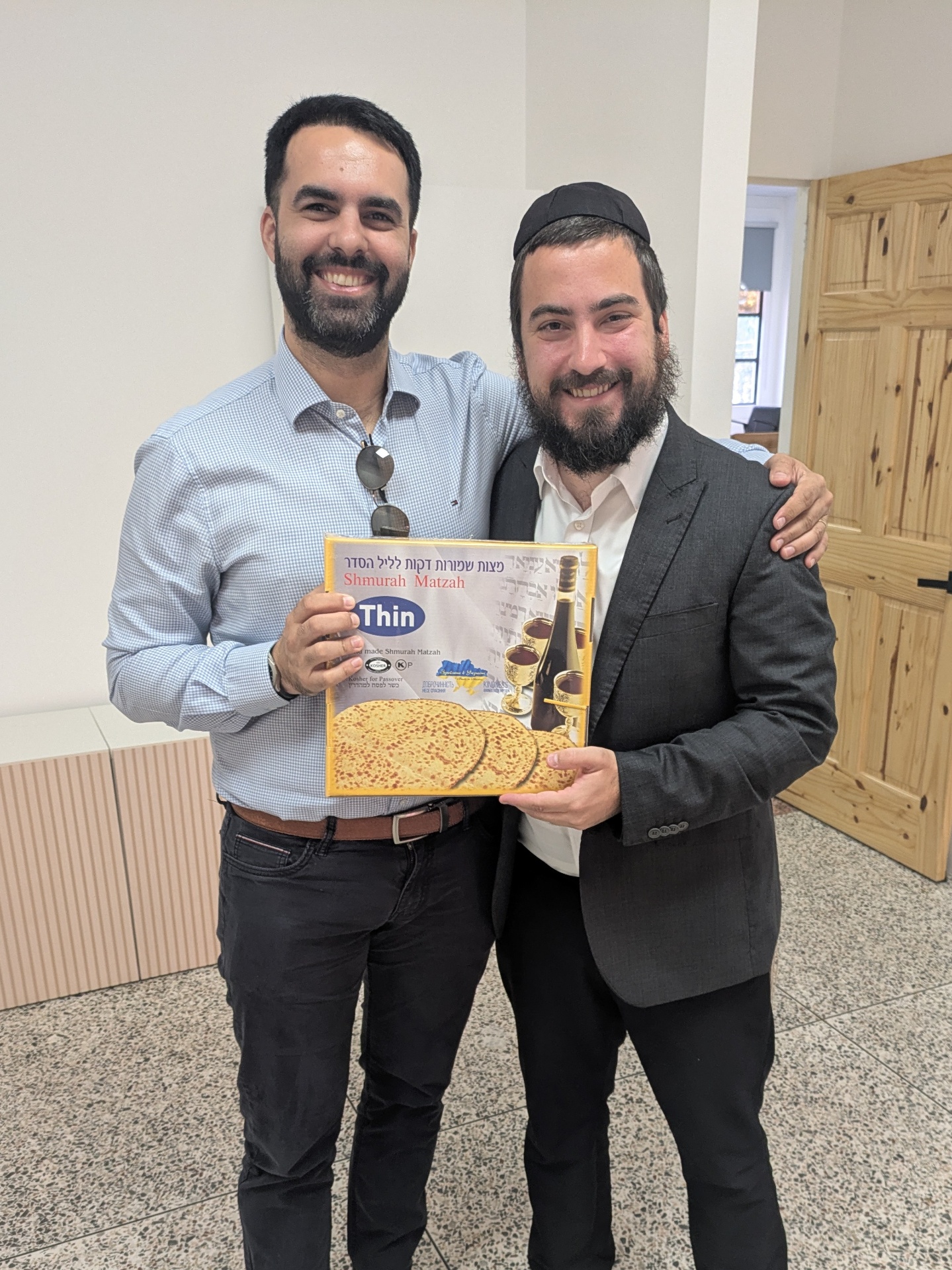 Sharing matzah with community members